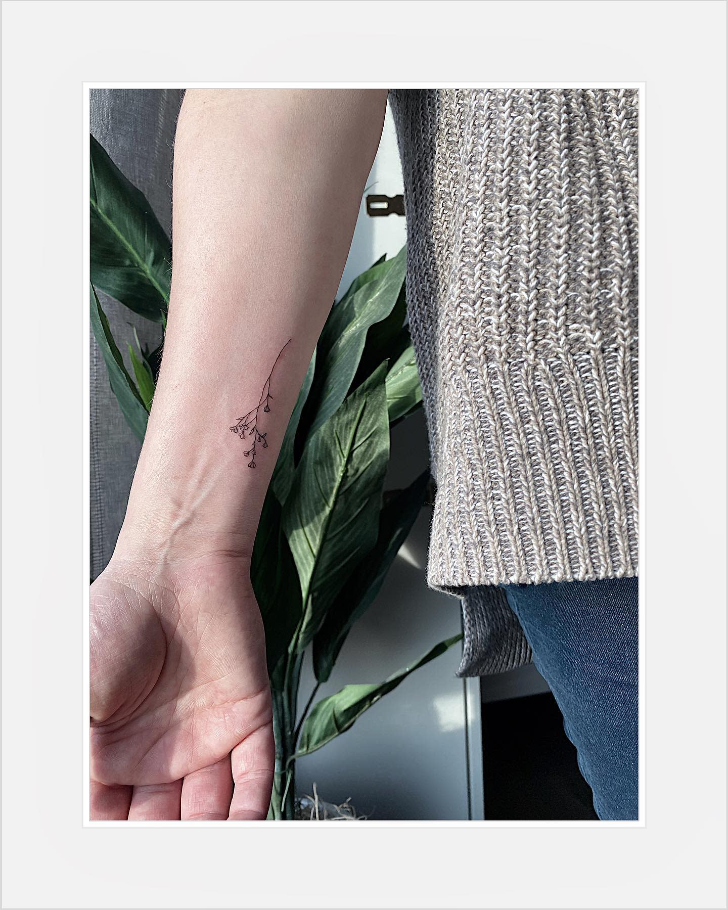 Small baby's breath tattoo on a wrist