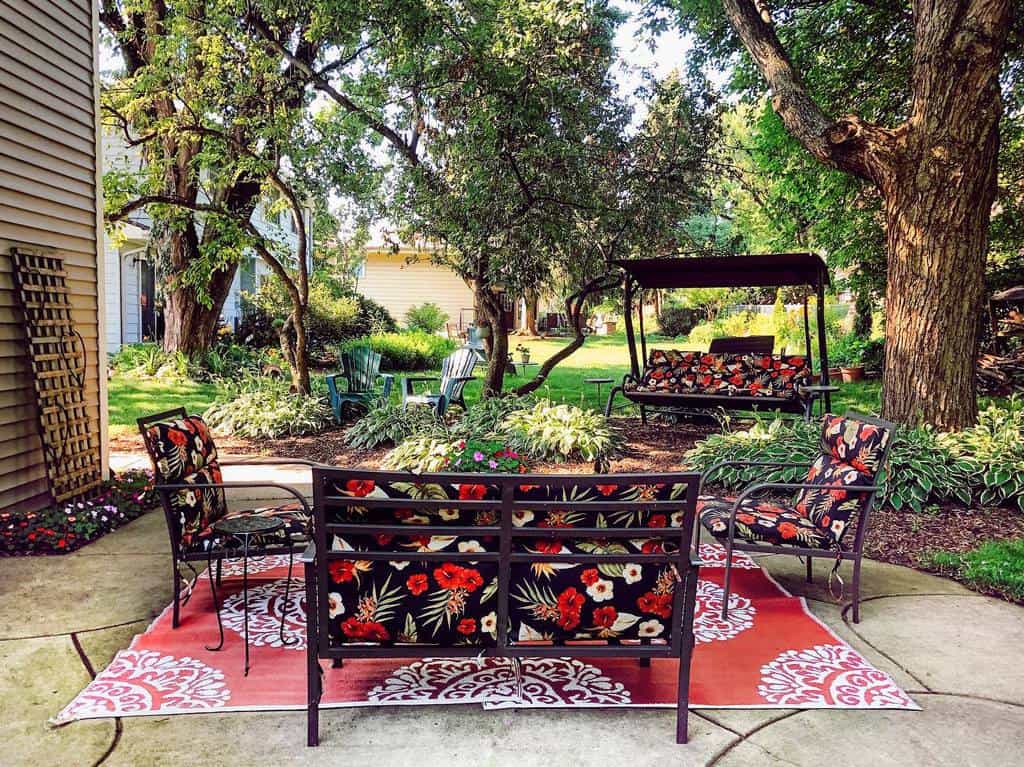 backyard patio garden with floral furniture 