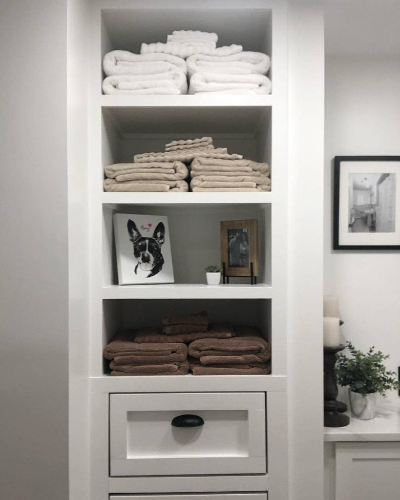 built-in shelving with drawers in bathroom