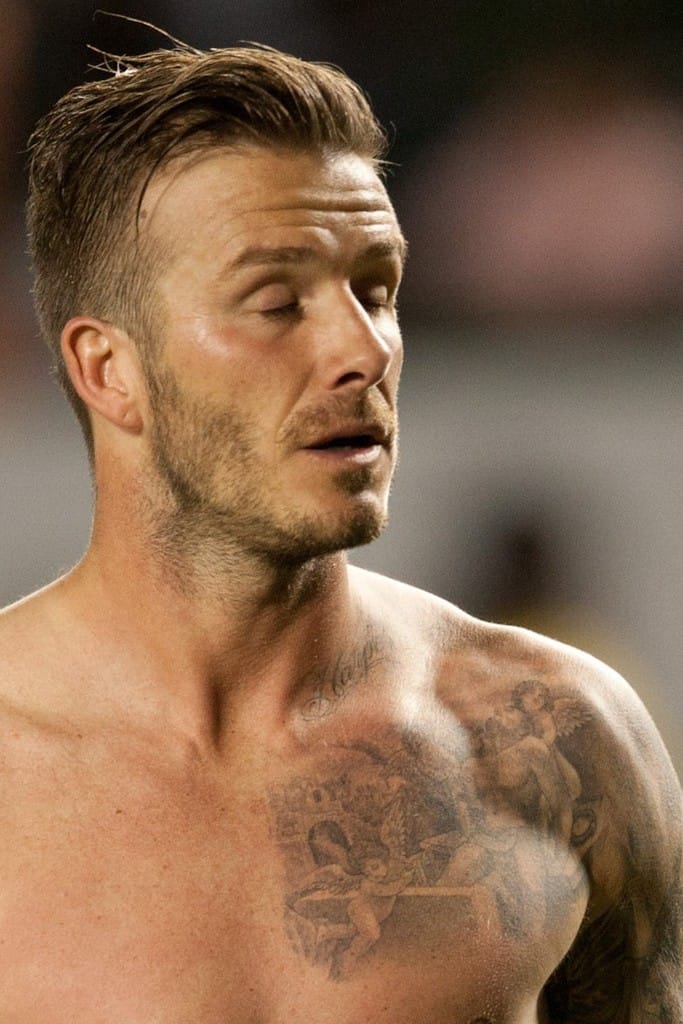 David Beckham's black and gray tattoo of the three cherubs carrying Jesus to his tomb