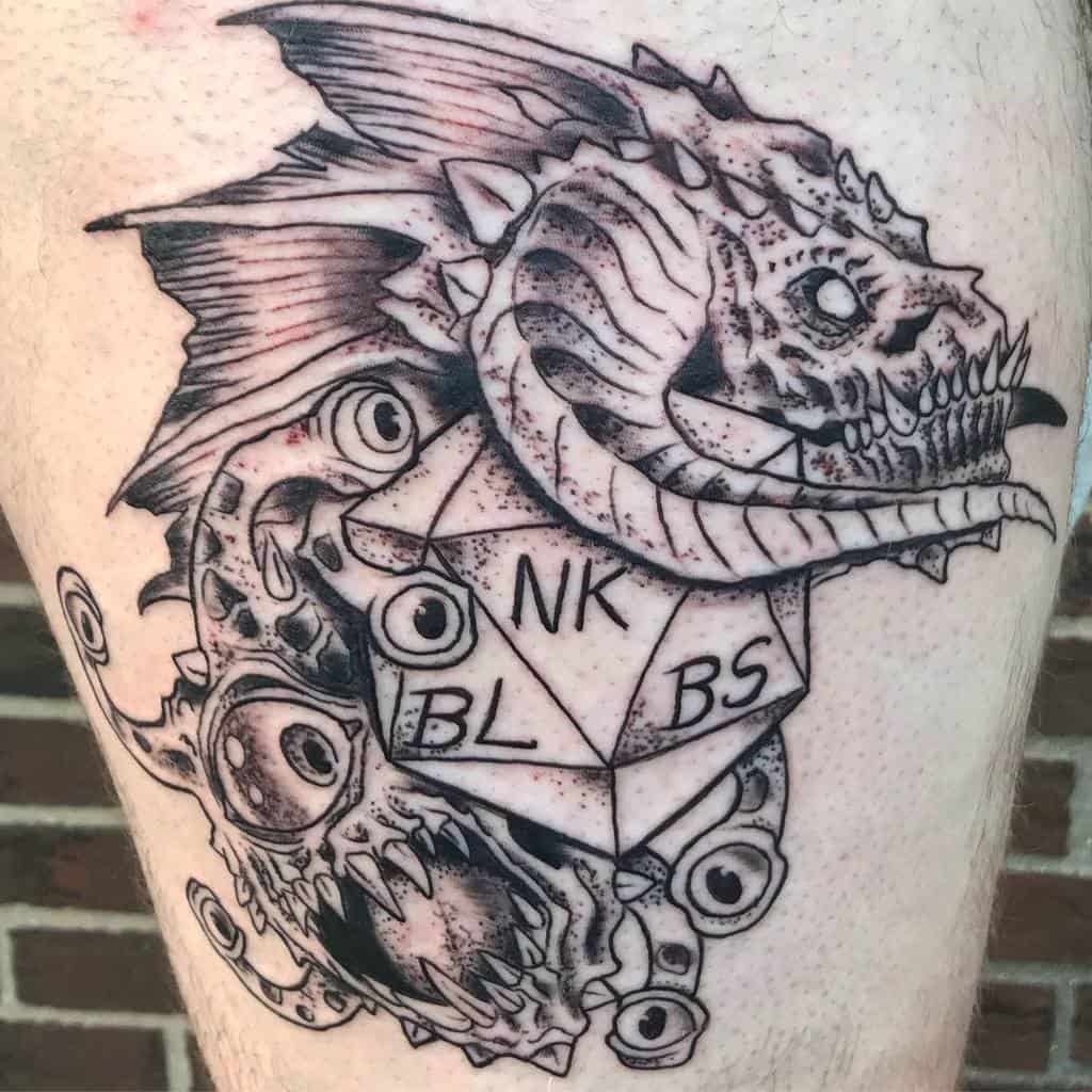 Intricate Dungeons & Dragons tattoo featuring a Beholder, dragon skull, and a D20 die with bold linework and shading