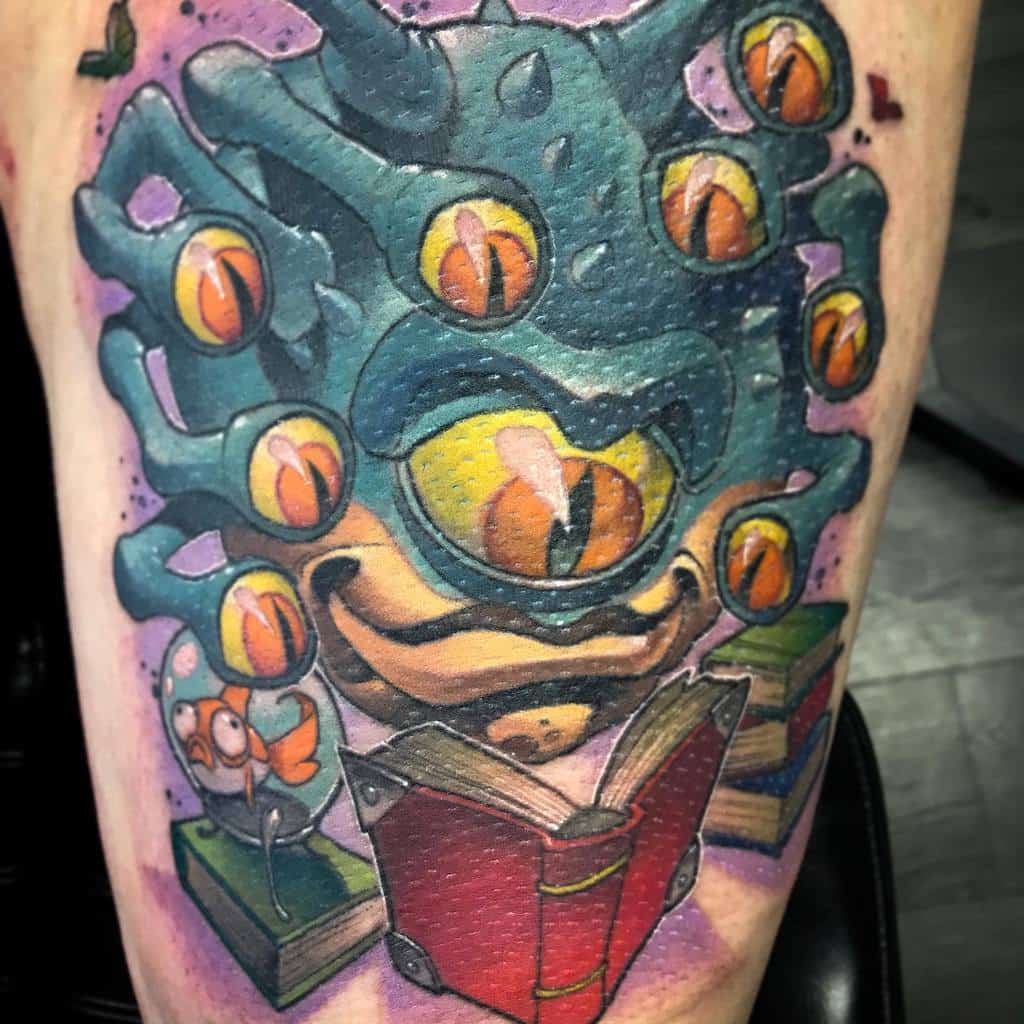 Vibrant Dungeons & Dragons tattoo of a Beholder surrounded by books, with glowing orange eyes and a whimsical goldfish detail