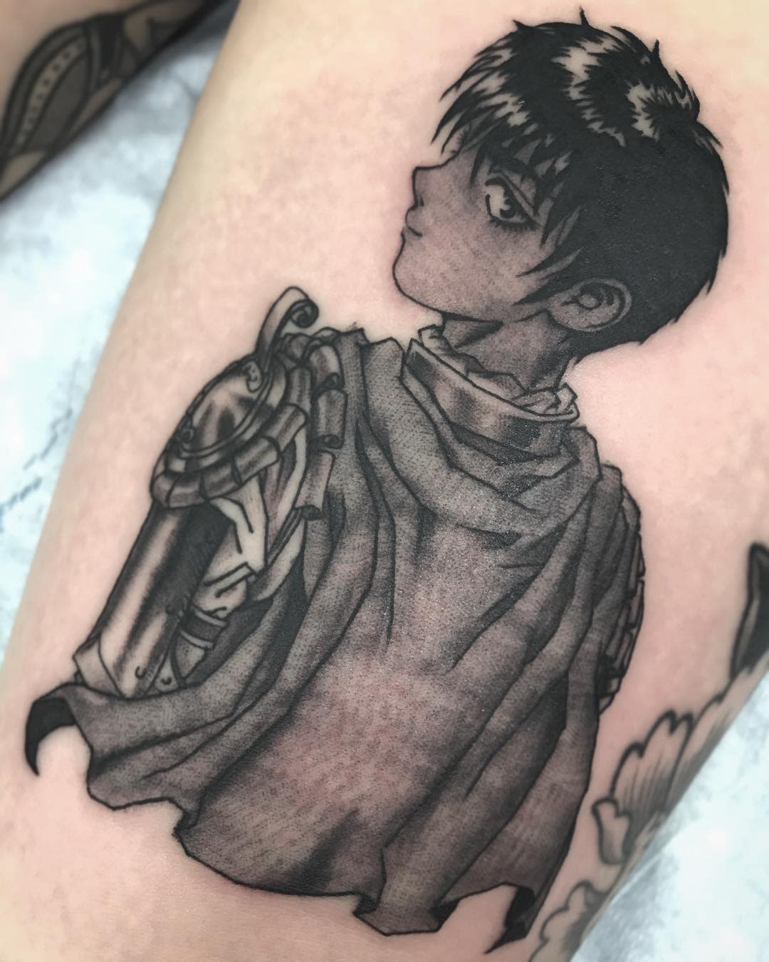 Black and gray tattoo of Casca from Berserk, depicted in armor with a contemplative expression