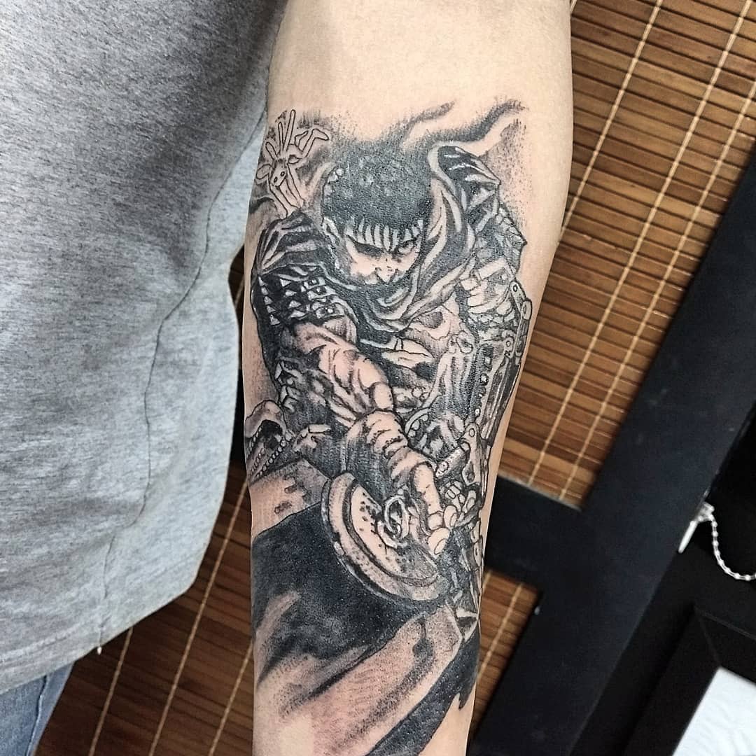 Detailed forearm tattoo of Guts from Berserk, depicted in battle stance with intense shading and intricate armor details