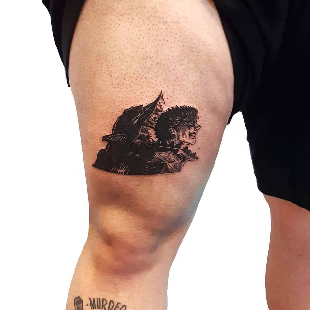 Small, detailed tattoo of Guts in the Berserk Armor on the thigh, featuring his intense expression with the wolf-like helmet in the background