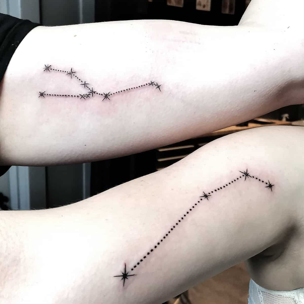 Tattoo of star constellations connecting dot and star patterns on two arms