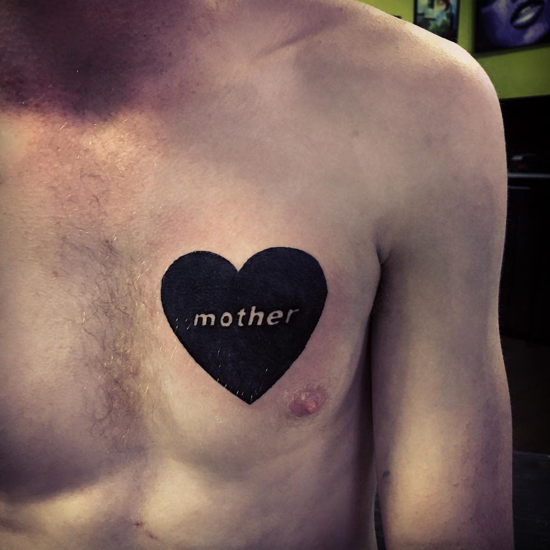 Simple black heart tattoo with the word 'mother' inscribed inside