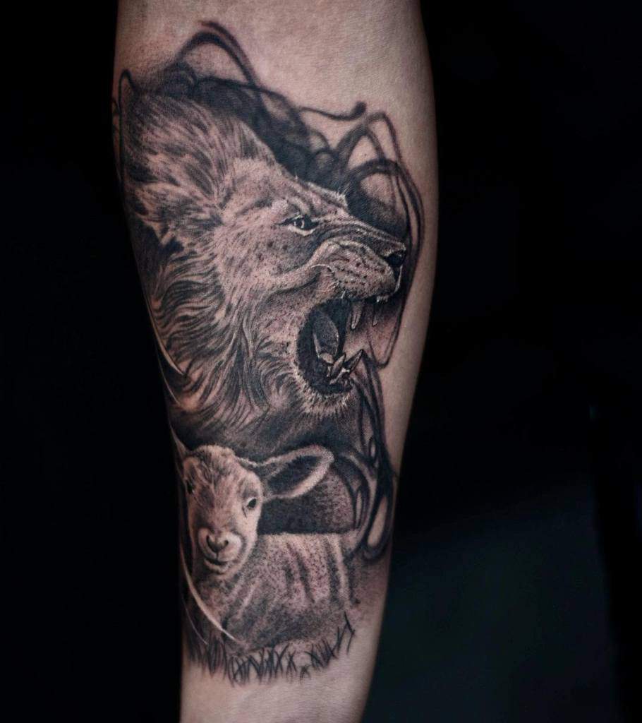 A striking tattoo of a lion roaring triumphantly above a serene lamb, enhanced by abstract shading in the background