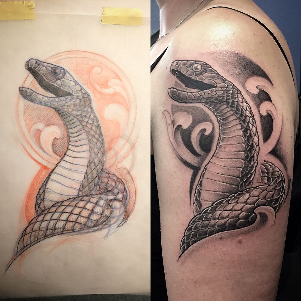 Black mamba tattoo on an upper arm