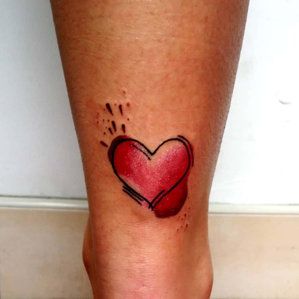 Stylized red heart tattoo with bold black outlines and sketch-like details