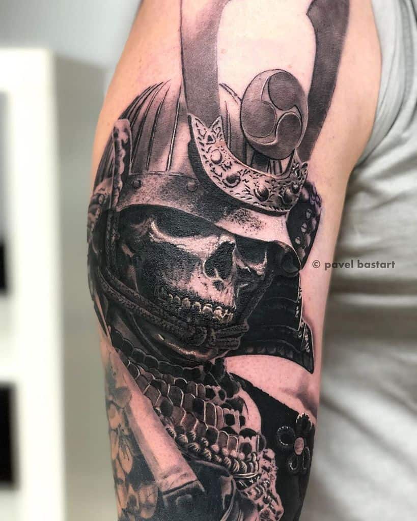 Detailed tattoo of a samurai warrior with a skull face on an arm