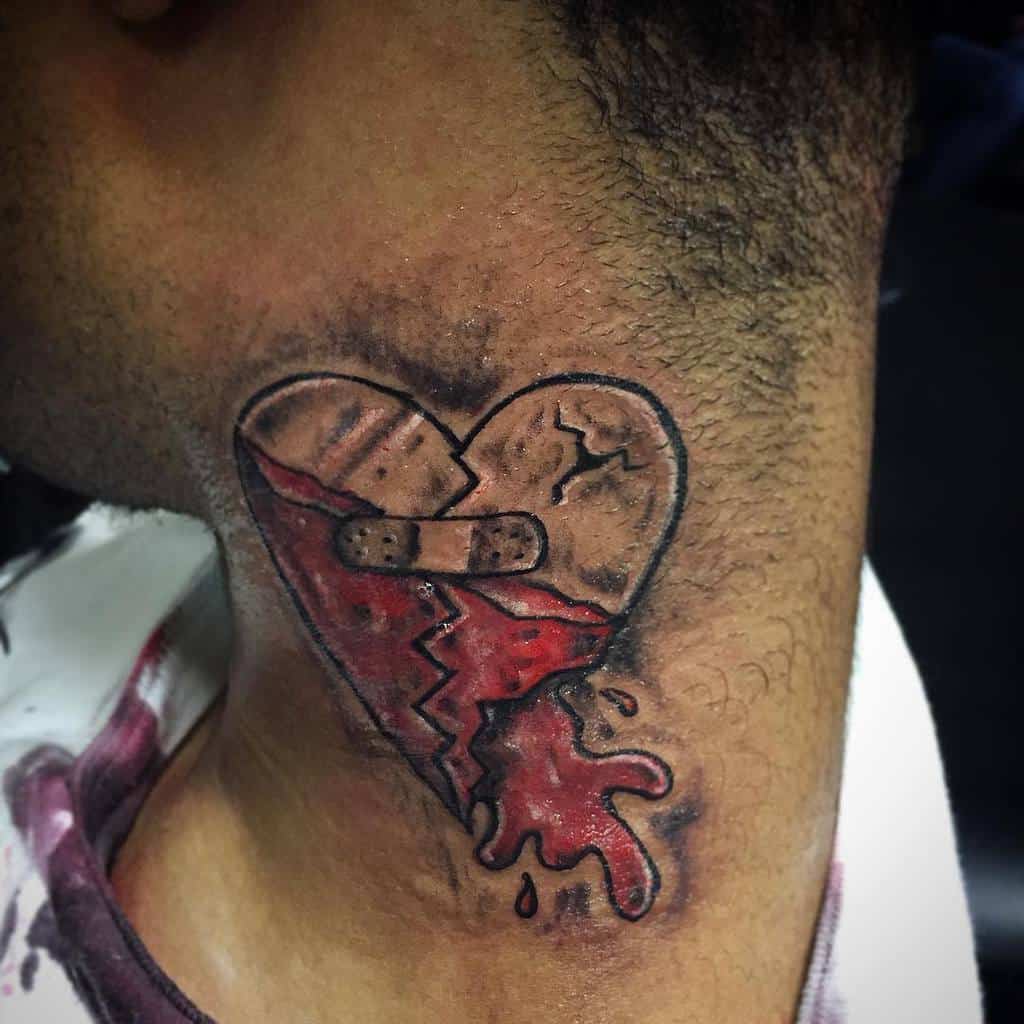 Tattoo of a bleeding heart, broken and bandaged, on the side of a person's neck
