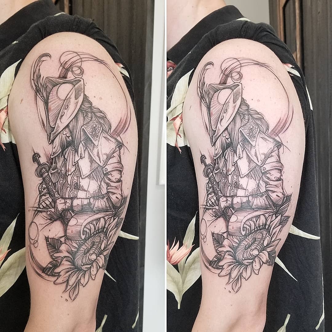 Bloodborne-inspired tattoo featuring a hunter in detailed attire with a sword and sunflower motif
