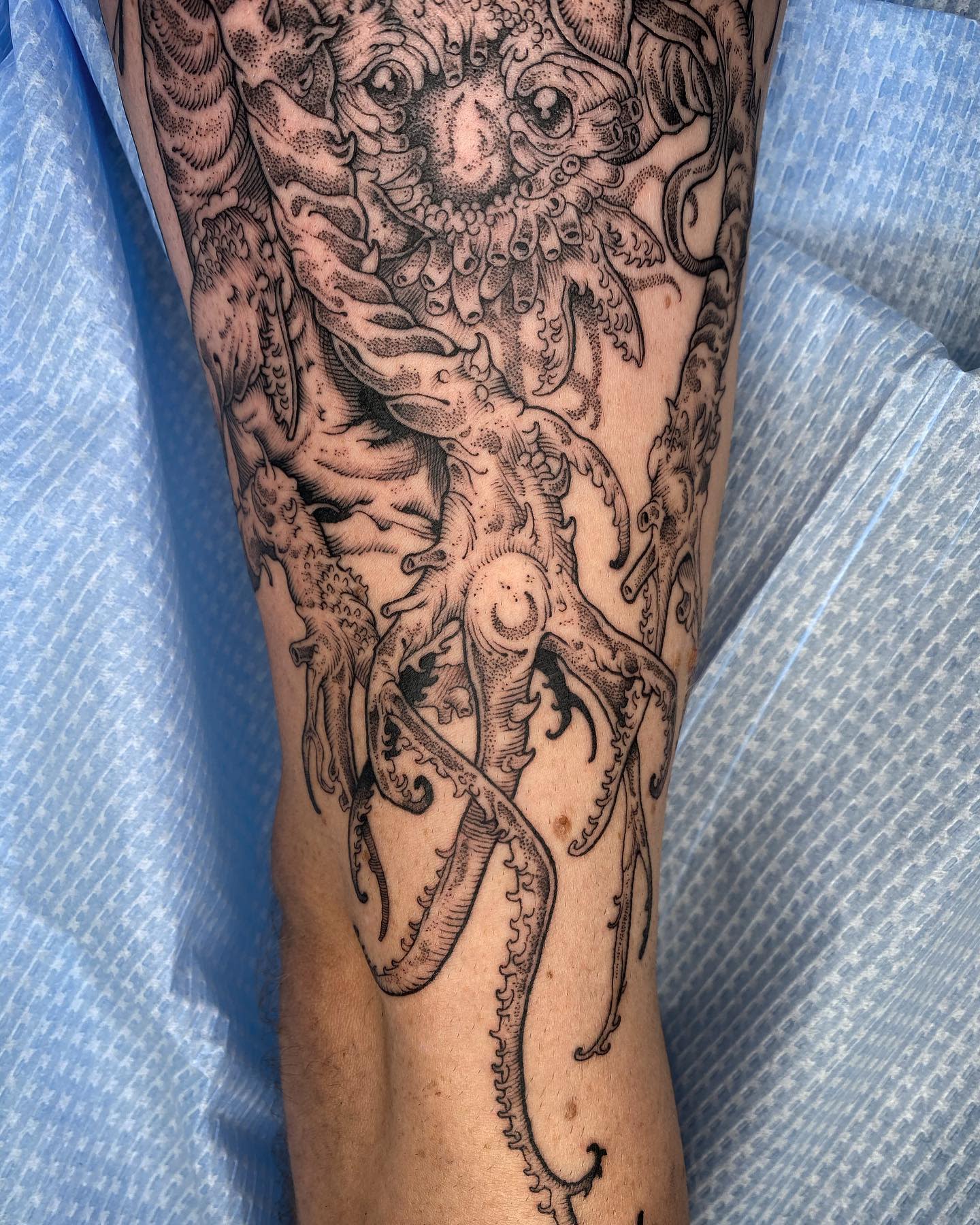 Bloodborne-themed tattoo depicting a grotesque, tentacled monster with intricate linework