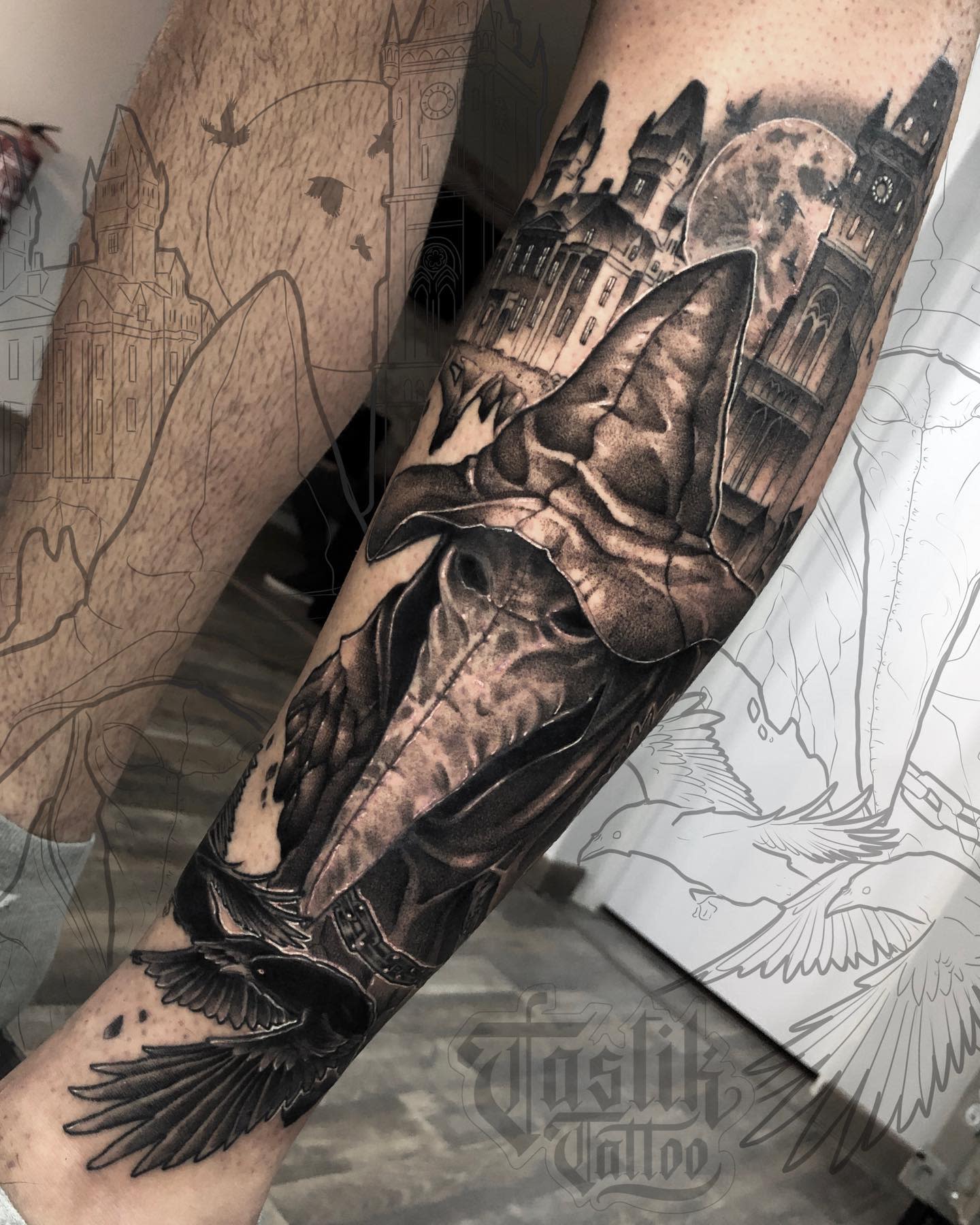 Detailed tattoo of Eileen the Crow beneath a full moon, surrounded by gothic buildings