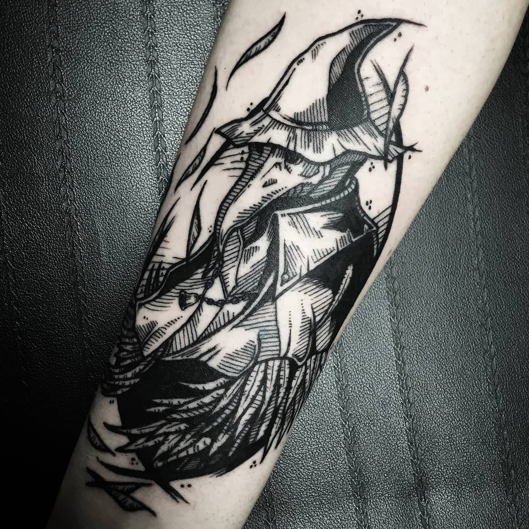 Tattoo featuring a stylized Eileen the Crow hunter with sharp, angular lines and dark shading