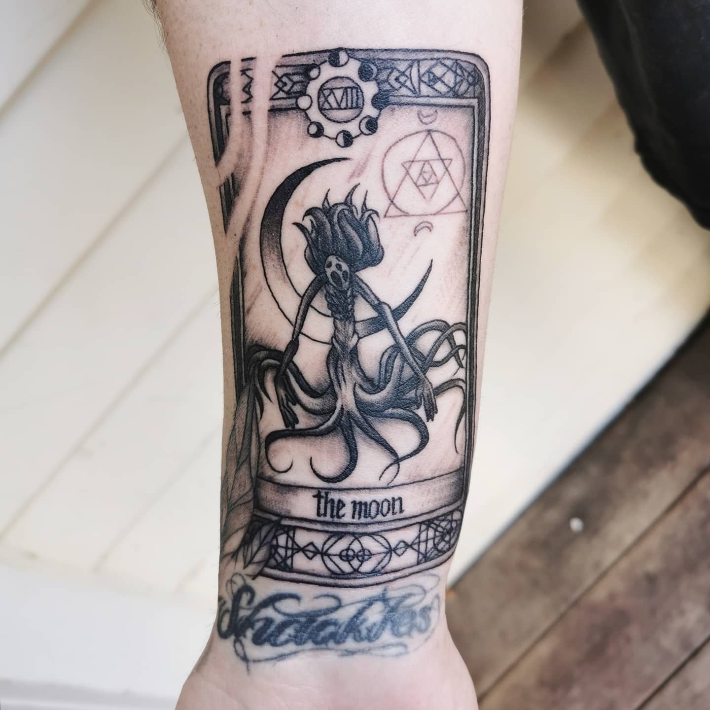Bloodborne tarot card-style tattoo featuring a mysterious tentacled figure under 'The Moon' title