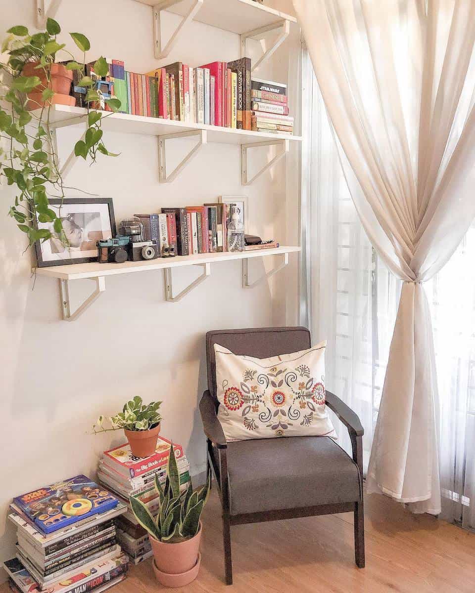small living space with white wall shelf and accent chair