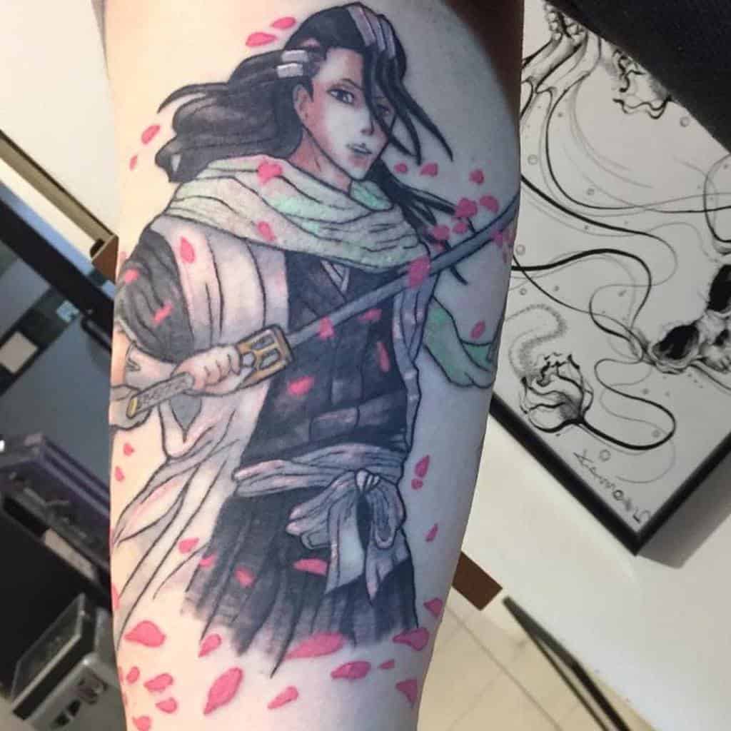 Colorful tattoo of Byakuya Kuchiki from Bleach, wielding his sword with flowing petals of Senbonzakura around him
