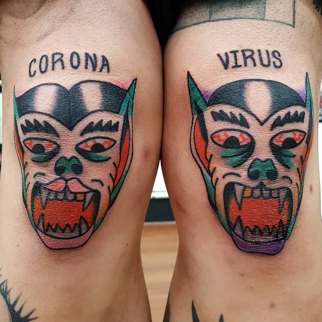 Two colorful monster face tattoos on knees with "CORONA" and "VIRUS" written above