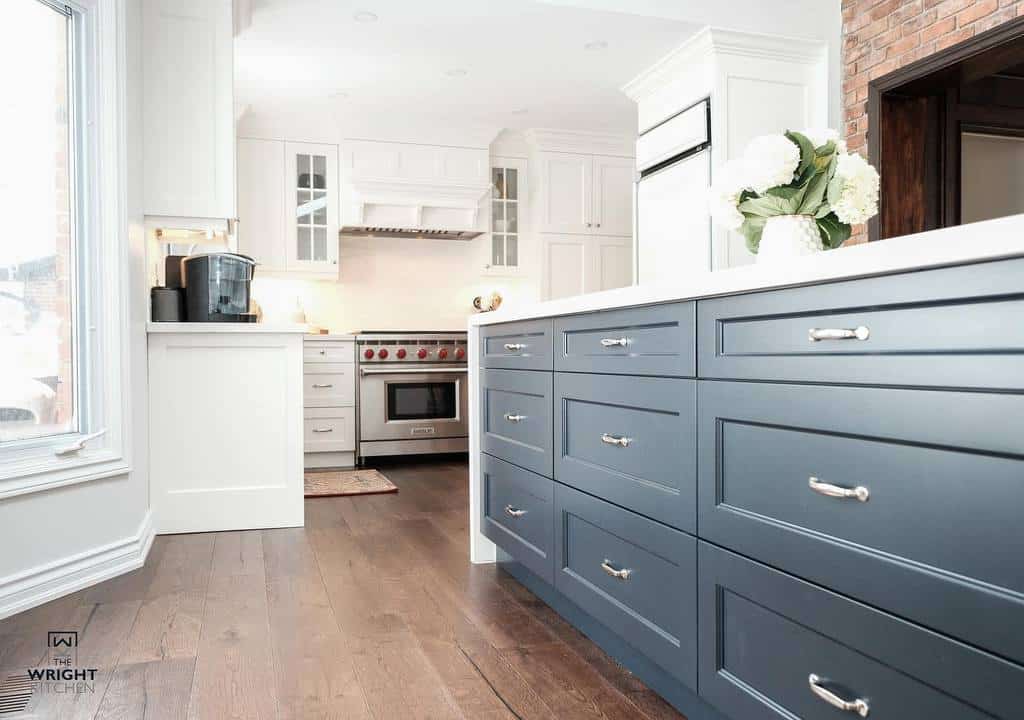 white and blue kitchen cabinets wood flooring