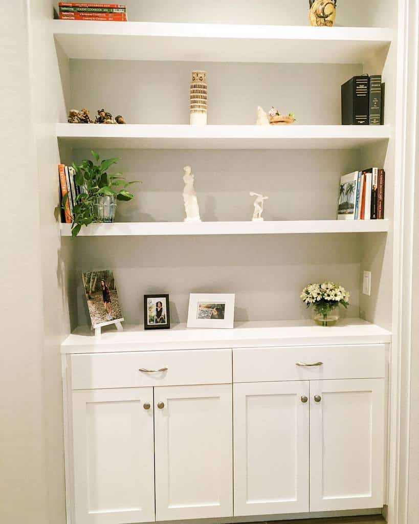 white cabinet with shelves in home