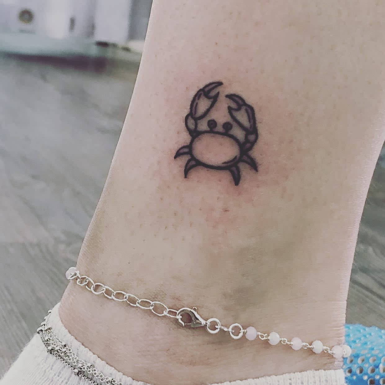 Small cancer tattoo on inner ankle 