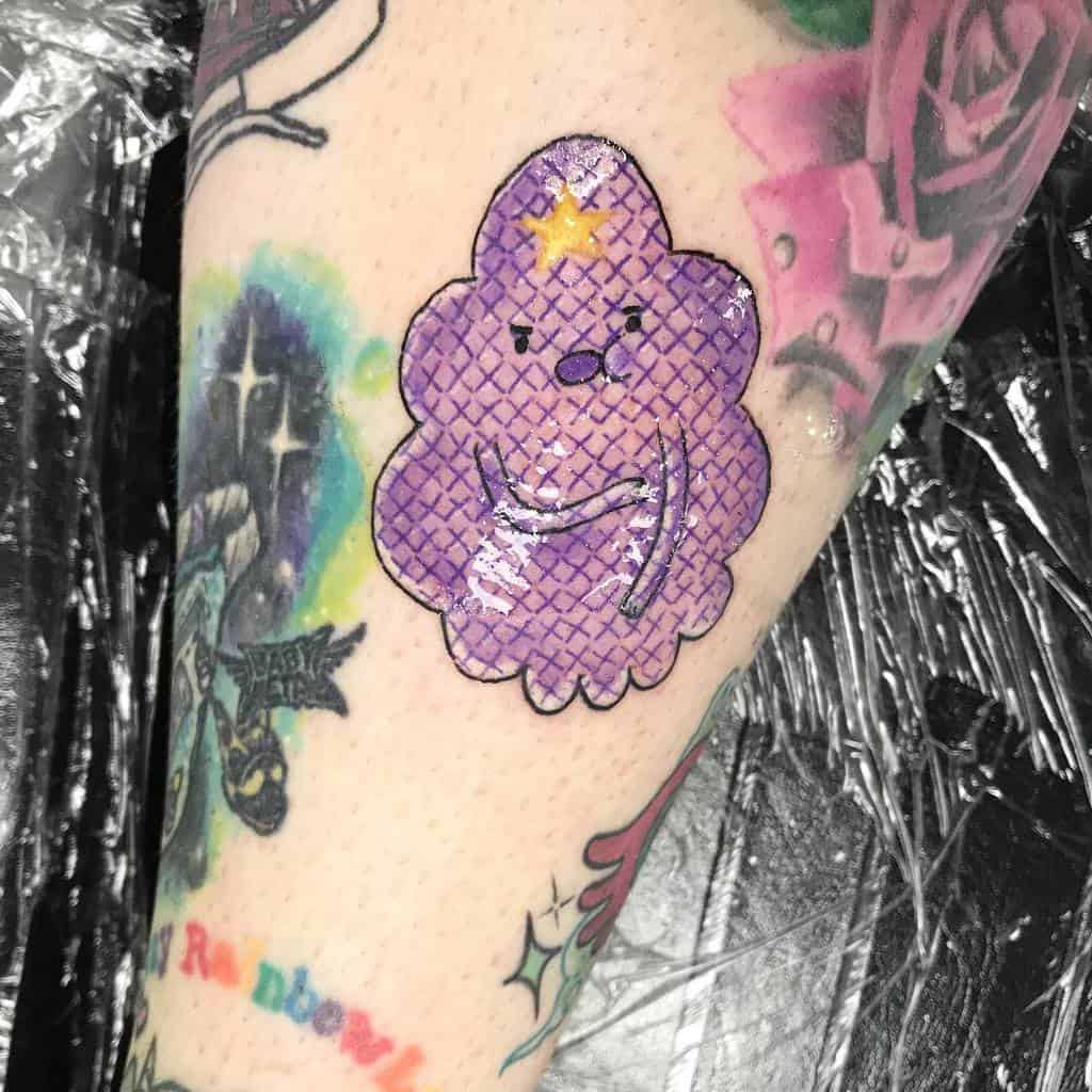 Cross-stitch style tattoo of Lumpy Space Princess from Adventure Time, in vibrant purple tones