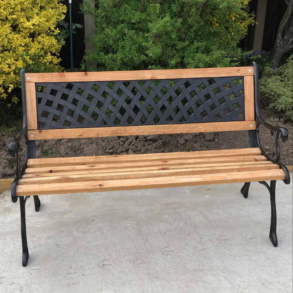 black painted cast iron frame wood lattice work bench