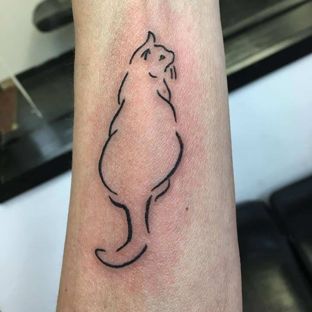 Simple outline tattoo of a cat depicted from behind gracefully inked on a person's forearm