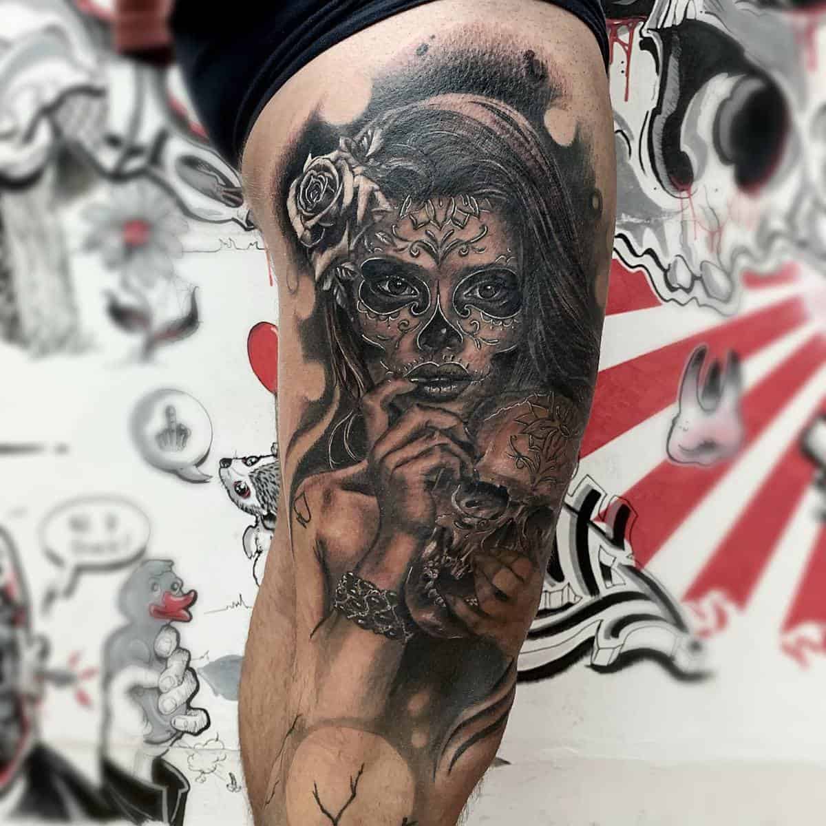 Catrina tattoo featuring a woman with sugar skull makeup, holding a skull, and adorned with a rose