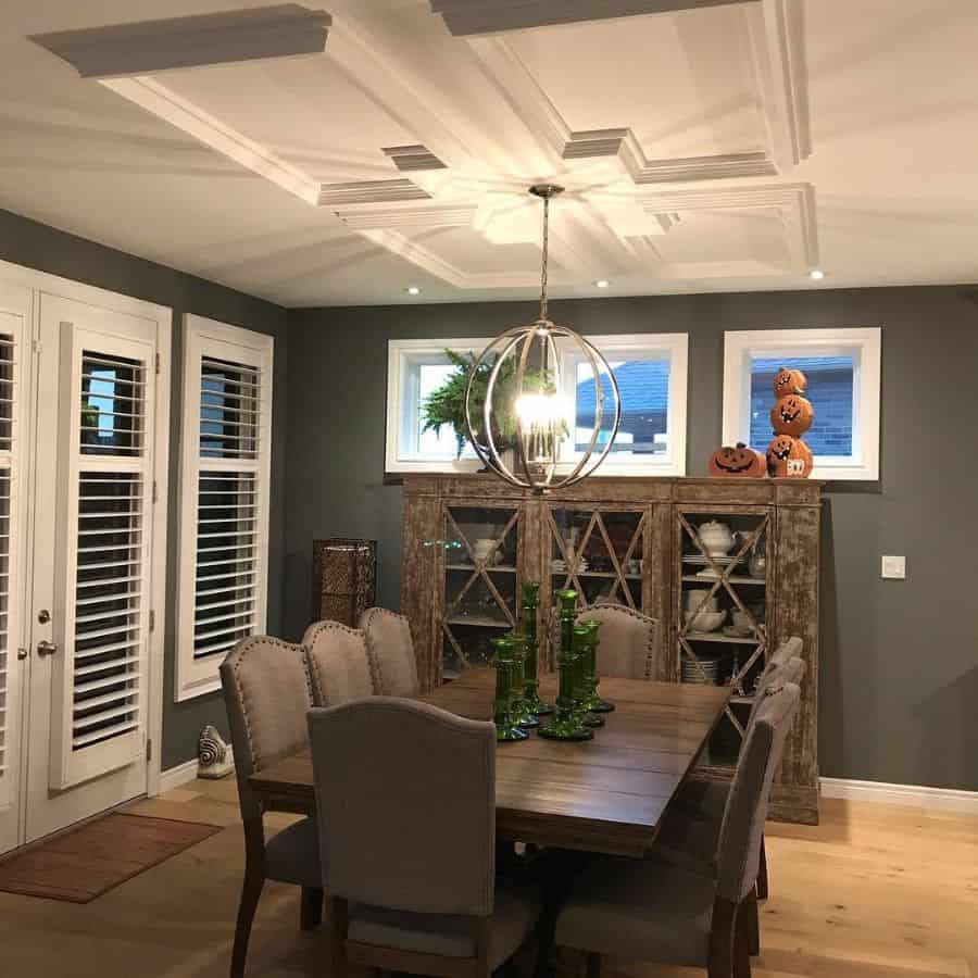 contemporary dining room wood dining table and chairs textured ceiling chandelier