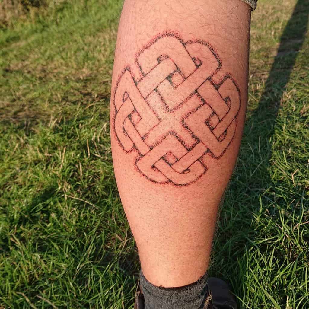Celtic knot tattoo on a person's calf