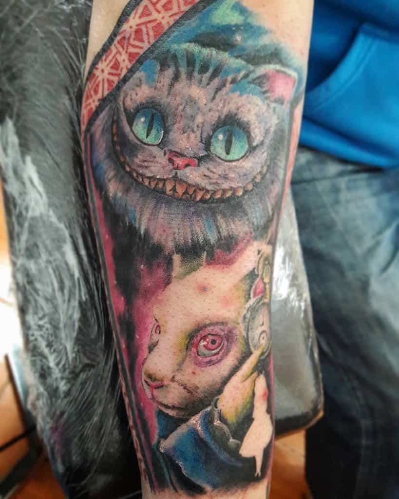 Vibrant tattoo of the Cheshire Cat and the White Rabbit from Alice in Wonderland, with bright colors and intricate details