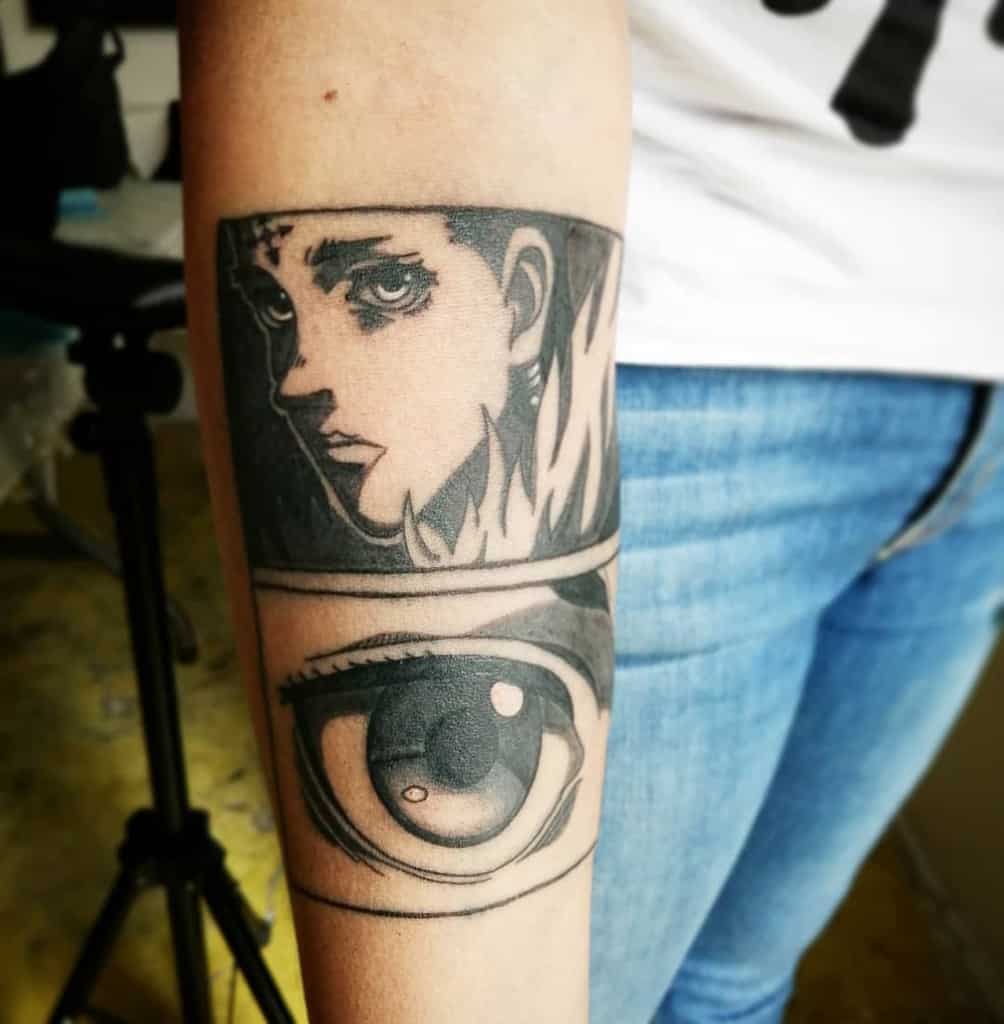 Black-and-grey forearm tattoo featuring Chrollo Lucilfer from Hunter x Hunter, paired with a detailed close-up of an expressive eye