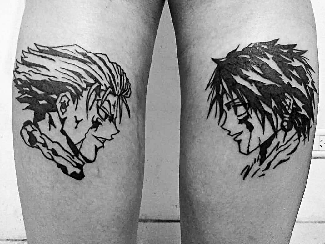 Bold black-ink tattoos of Hisoka and Chrollo Lucilfer from Hunter x Hunter, facing each other on opposite legs in striking detail