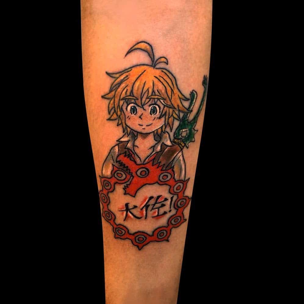 Colorful tattoo of a young Meliodas from The Seven Deadly Sins, holding his sword, Dragon’s Sin of Wrath and featuring the Japanese characters for 'Kiba' (meaning 'fang')