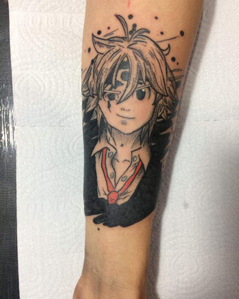 Black and white tattoo of Meliodas from The Seven Deadly Sins, featuring his third eye and confident expression, with ink splatters surrounding him