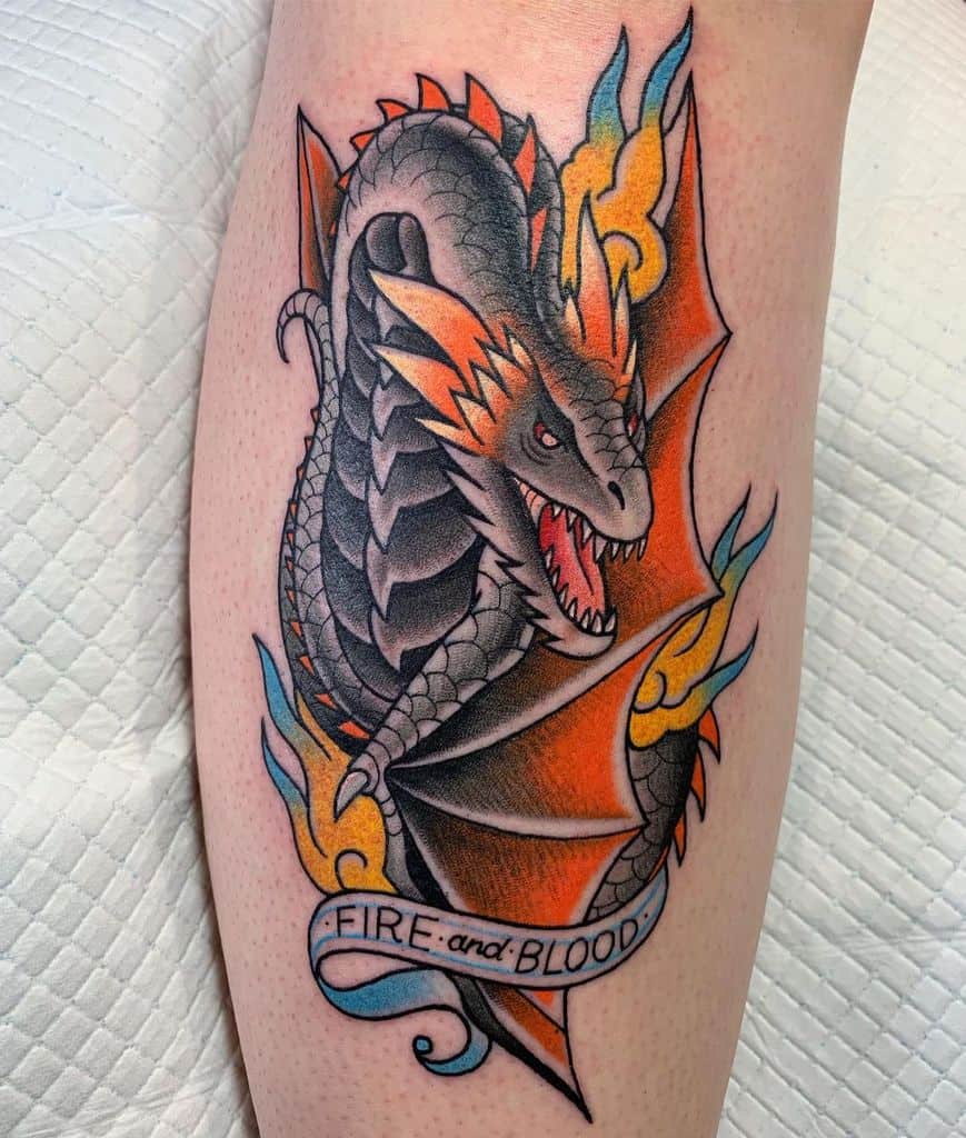 Vibrant tattoo of a dragon with orange flames and the banner 'Fire and Blood,' inspired by House Targaryen from Game of Thrones