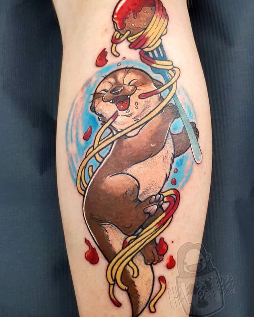 Tattoo of an otter delightfully twirling spaghetti with a fork, surrounded by blue splashes and a playful meatball