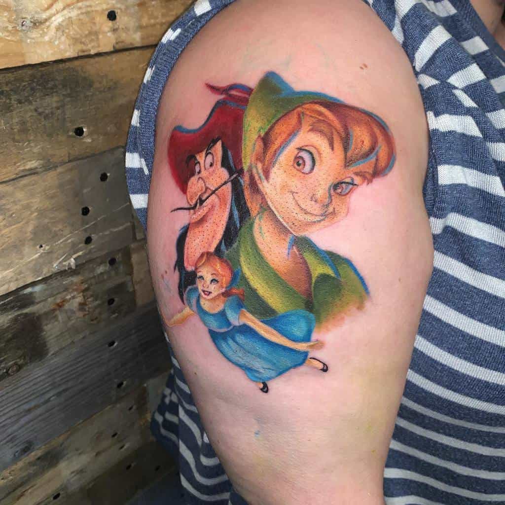 Vibrant tattoo of Peter Pan, Captain Hook, and Wendy, featuring bold colors and a smooth, painterly style