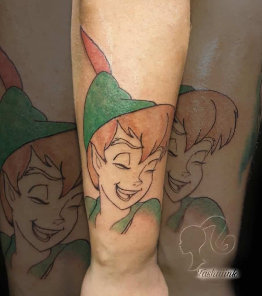 A vibrant full-color tattoo of a playful character in green attire with red hair, smiling joyfully, inspired by watercolor shading