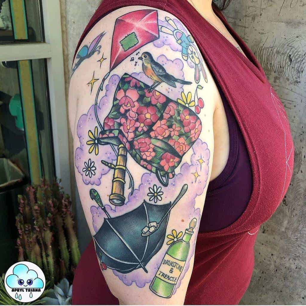 Bright, colorful arm tattoo with various nature and whimsical designs