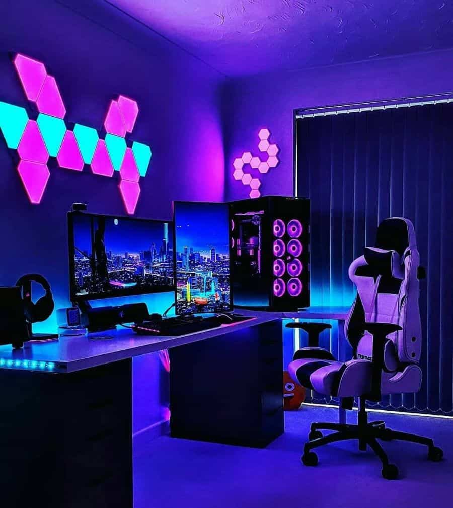A gaming setup with dual monitors, RGB lighting, wall panels, and a black and white chair