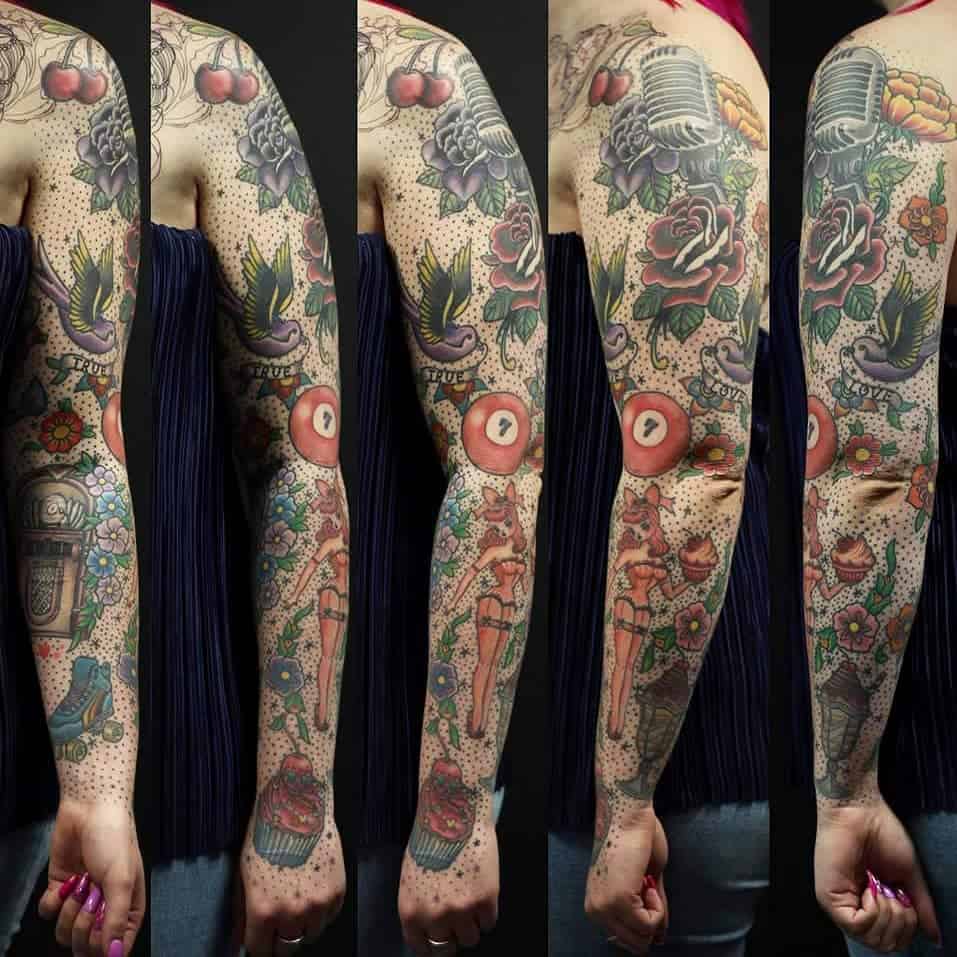 Woman's arm with colorful, vintage-style tattoos
