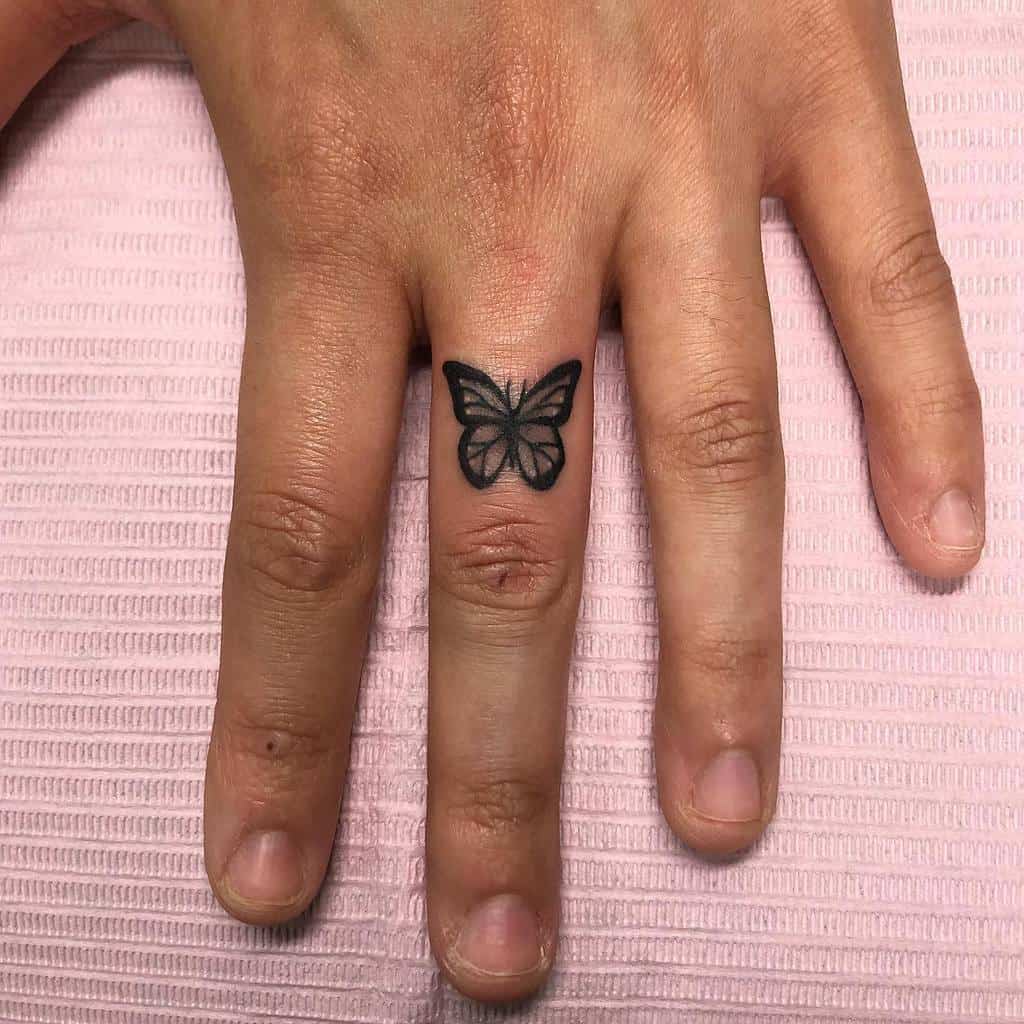 Small butterfly tattoo on a finger 