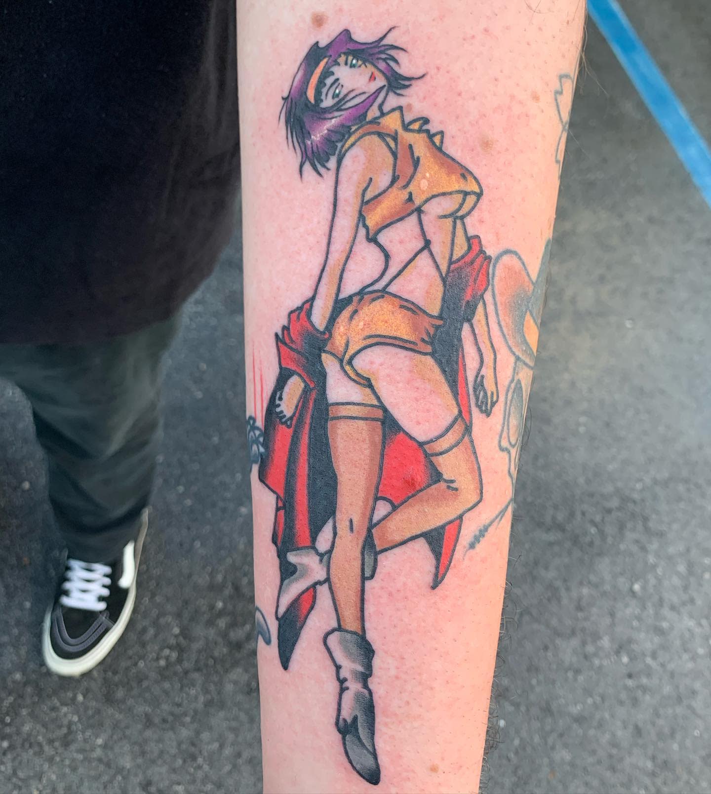 Tattoo of Faye Valentine from Cowboy Bebop, striking a confident pose in her iconic outfit