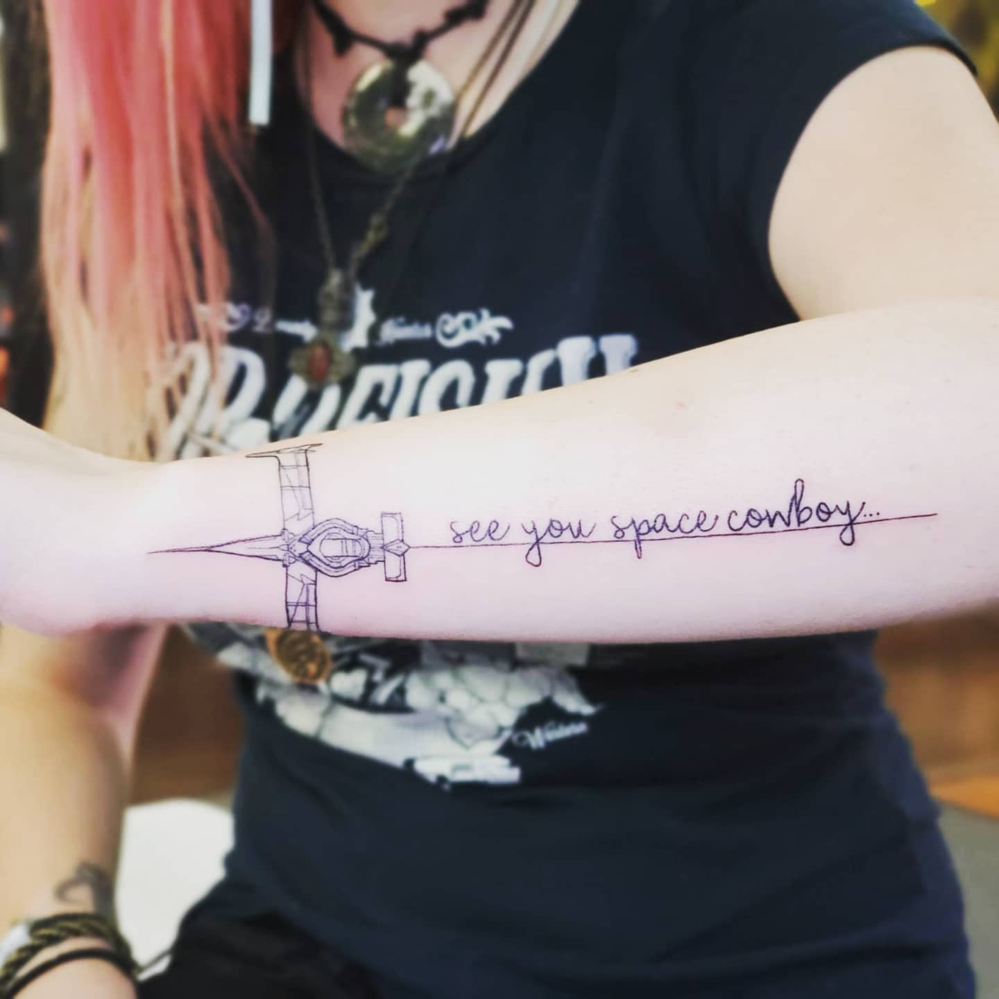 Forearm tattoo featuring the Swordfish II from Cowboy Bebop with the phrase 'see you space cowboy...