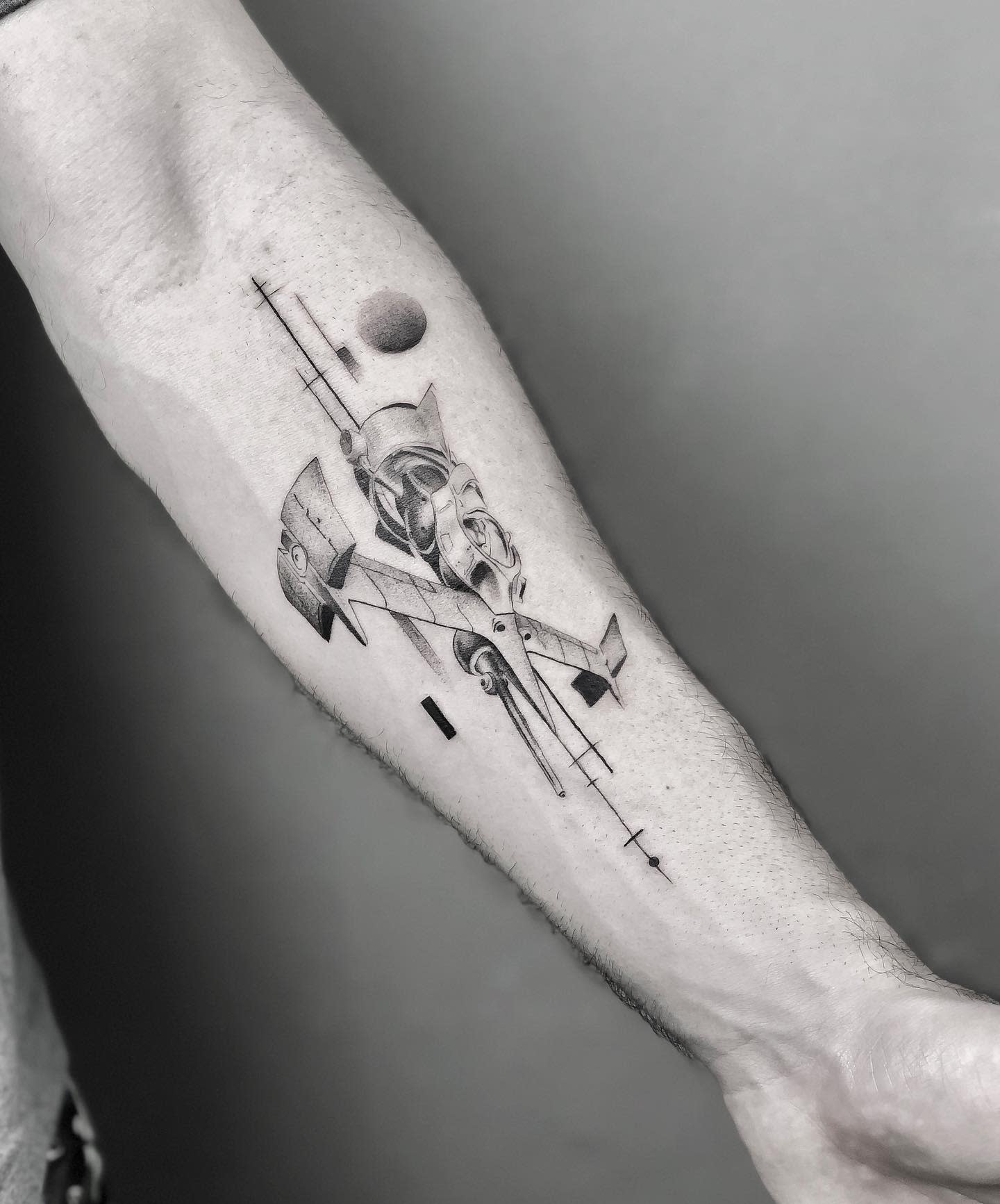 Tattoo of the Swordfish II spaceship from Cowboy Bebop, depicted in a sleek, geometric style