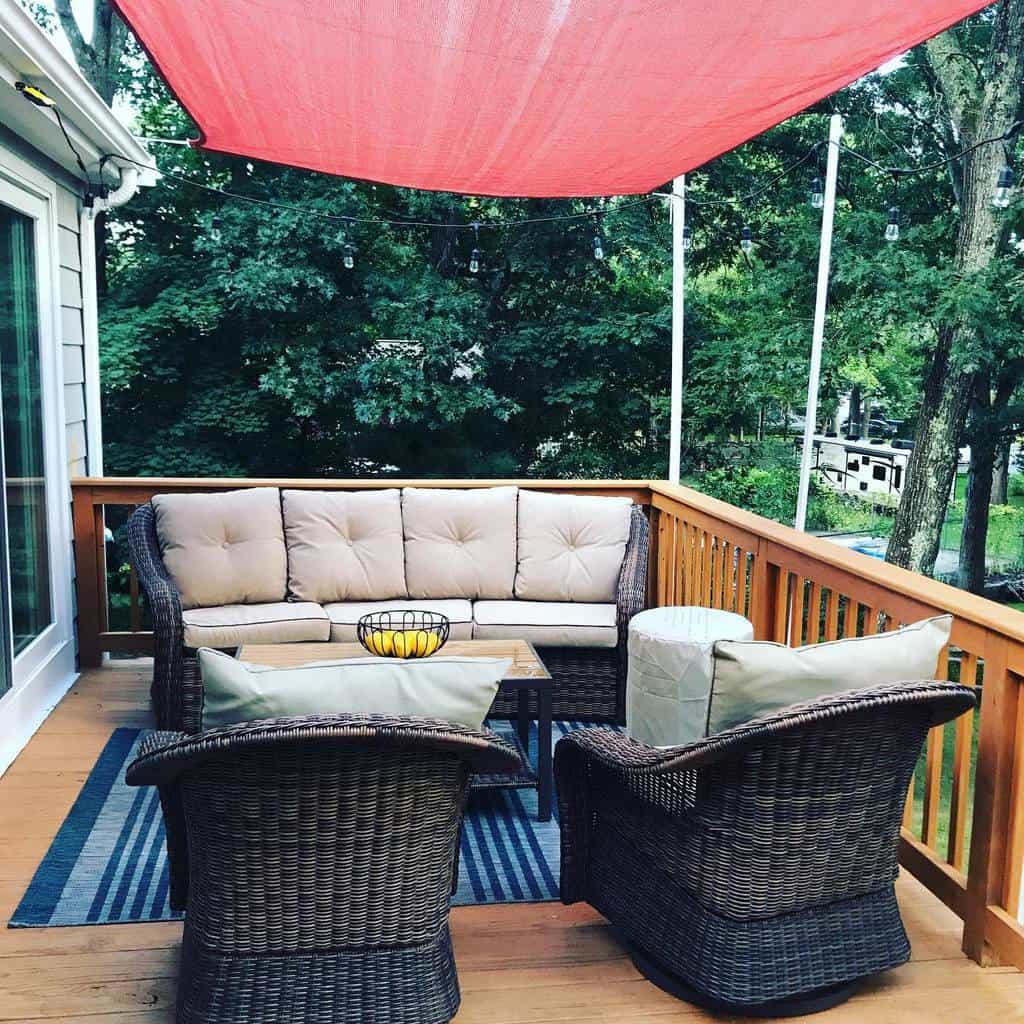 outdoor wood deck red patio shade wicker chairs